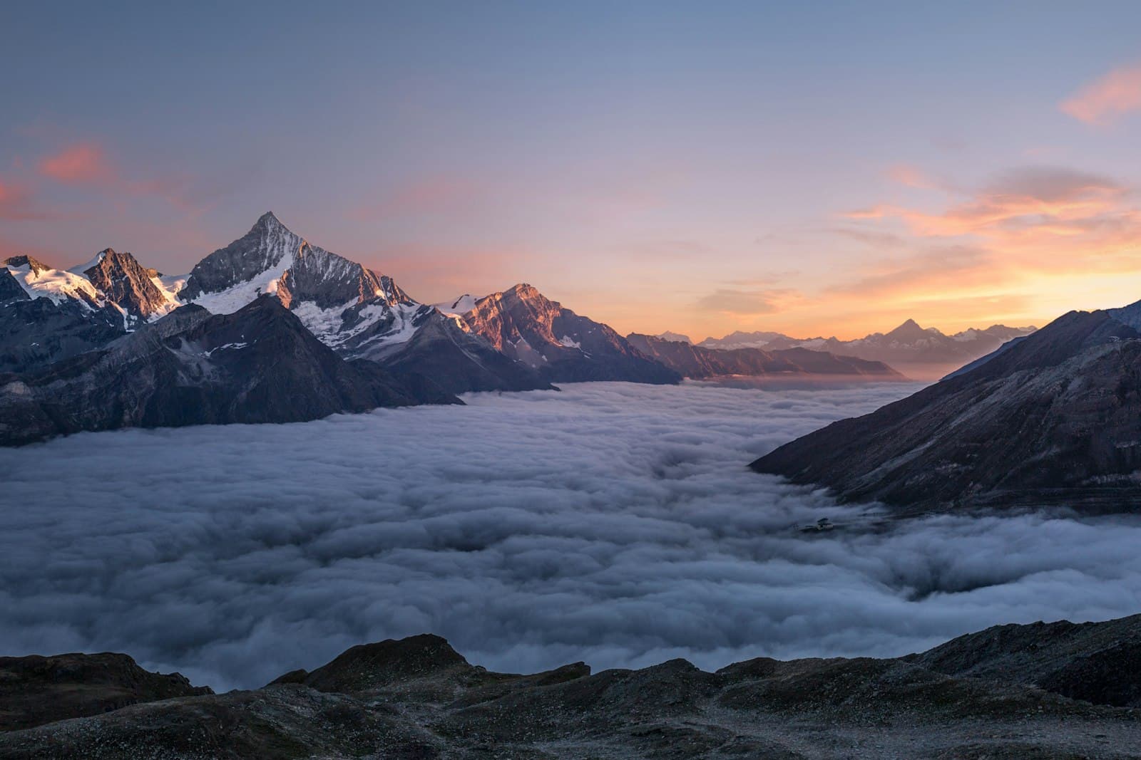 Snow-capped mountain range under a clear sky